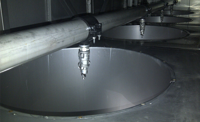 PNR Spiral Nozzles in a paint booth in the Powder Coating Industry. PNR UK Ltd. Full cone spiral nozzles.